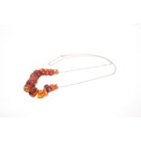 Amber necklace with sixteen graduated amber disc-shape beads,