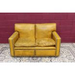 Stylish close-button mustard-leather upholstered two seater sofa of square form