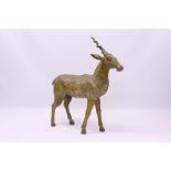 Eastern carved and polychrome painted model of a deer,