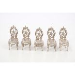 Set of five contemporary silver miniature salon chairs - including one with a lift-up seat,