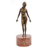 Early 20th century gilt bronze figure of a standing female nude, on circular marble base,