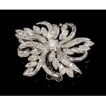 Diamond floral spray brooch, the stylised foliate spray set with brilliant,