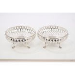 Pair early 20th century silver bowls of circular form, with pierced decoration and floral border,