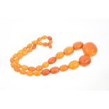 Old amber necklace with a string of graduated butterscotch amber beads,