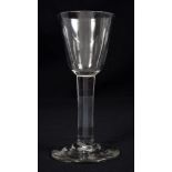 Mid-18th century Georgian wine glass with plain bowl and stem on thick splayed base, 16.