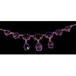 Victorian-style amethyst necklace with three amethyst pendant drops suspended from a line of seven