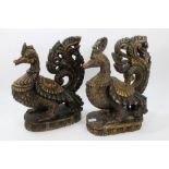 Pair of 19th century Indian Hamza polychrome painted carved wood birds on integral lotus carved