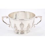 1920s silver dish of circular form, with applied decorative strapwork and twin scroll handles,