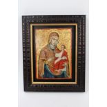 Antique Greek Orthodox Icon painted on panel depicting Mary and baby Jesus, mounted in later frame,