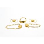 Five pieces of ancient gold jewellery - to include a pair of earrings with circular domed discs