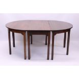 George III mahogany dining table with central drop-leaf section and twin demi-lune end sections,