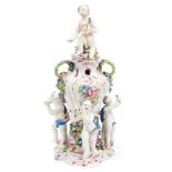 Fine 18th century Bow polychrome porcelain vase with putto mount to lid and three putti supporters