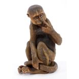 Late 19th / early 20th century glazed and painted pottery monkey,