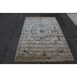 French-style rug with cream ground and central floral bouquet with radiating scrolling ornament,