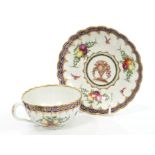 Fine 18th century Worcester fluted teacup and saucer - finely polychrome painted with fruit,