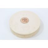 Early 19th century circular ivory table snuff box with engraved yellow metal plaque with crest to