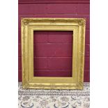19th century gilt gesso picture frame of swept form, with scroll ornament,