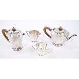 Late 1940s four piece silver tea set - comprising teapot of tapering form, with wooden loop handle,