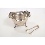 Contemporary silver sugar bowl of shaped oval form, with scroll border and engraved initials,