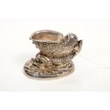 19th century cast white metal salt in the form of a nautilus shell on the back of a dolphin,