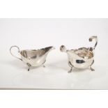 George III silver sauce boat of conventional form, with open scroll handle,
