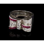 1940s ruby and diamond cocktail ring in the form of a stylised bow or buckle,