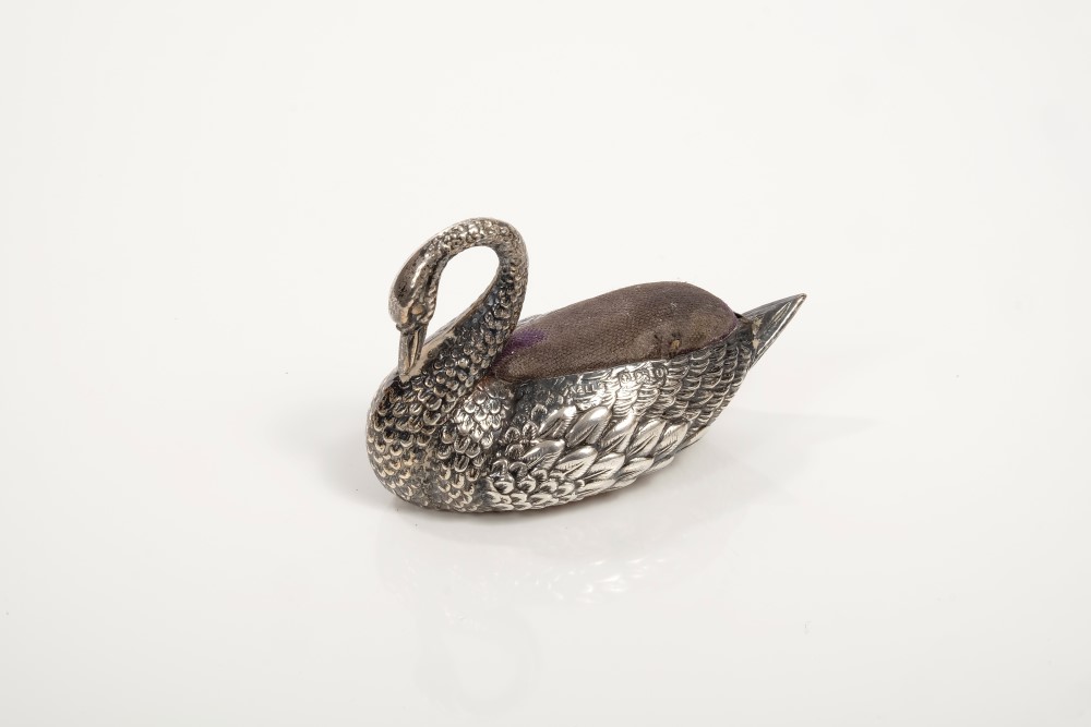 George V silver pincushion realistically modelled in the form of a swan with arched neck and inset