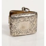 Edwardian silver stamp case of rectangular form, with chased and engraved foliate decoration,