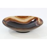 19th century carved brown agate oval dish raised on foot, 18.