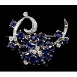 1960s diamond and sapphire floral spray brooch with oval mixed cut blue sapphires and brilliant cut