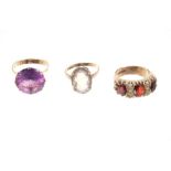 Three gold and gem set dress rings - various CONDITION REPORT Garnet and white stone