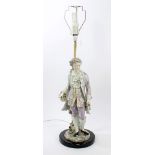 Large late 19th century German porcelain figure of a gentleman with basket of flowers,