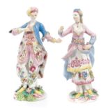 Two 18th century Bow porcelain figures wearing turbans, with floral painted decoration,