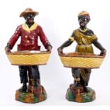 Large pair of late Victorian Forresters Majolica pottery Blackamoor figures holding baskets with