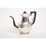 George V silver coffee pot of rectangular baluster form, with flared top,