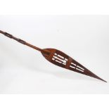 Old African carved wooden ceremonial paddle with leaf-shaped blade and pierced decoration,