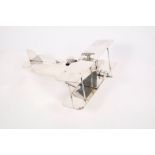 20th century silver plated novelty desk inkstand modelled as a First World War German biplane,