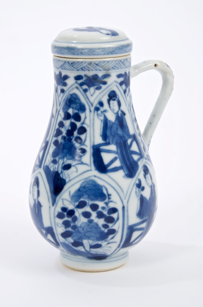 Late 17th century Chinese blue and white jug and cover with moulded and painted figure and floral