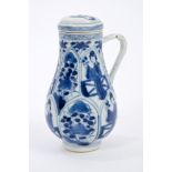 Late 17th century Chinese blue and white jug and cover with moulded and painted figure and floral