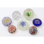 A collection of seven Victorian and later glass paperweights - including fish and seaweed and