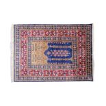 Fine quality Persian silk prayer rug on predominantly blue and red ground with gold thread,
