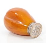 Late Victorian natural amber-handled seal with silver plated mount and NHS monogram,