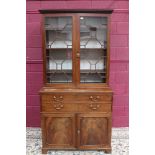 George III mahogany secretaire bookcase with dentil cornice and adjustable shelves enclosed by pair