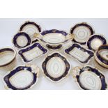 Early 19th century English part dessert service with gilt floral sprays on dark blue bands and