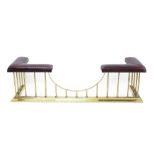 Brass and leather club fender with claret-coloured padded leather seat on colonnade supports and