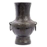 Antique Chinese bronze archaic-style vase with stylised leaf,