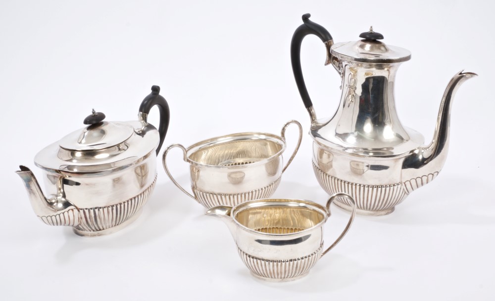 Victorian four piece silver tea set - comprising teapot of oval form, with half-fluted decoration,