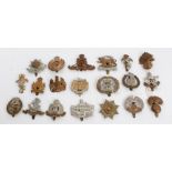 Collection of British Military cap badges - including Royal Artillery and the Gloucestershire