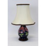 Moorcroft pottery table lamp decorated in the Anemone pattern on blue ground,