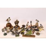 Large collection of Scandinavian carved 'folk art' birds - including three birds of prey and others,